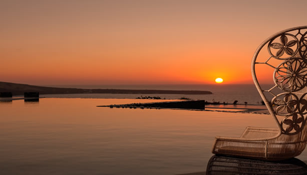 Santorini Babymoon at Santo Maris Oia Luxury Suites & Spa - main pool sunset